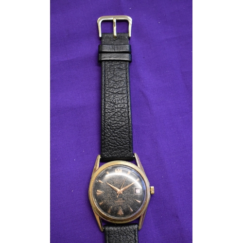 227 - Exactus, Men's Wrist Watch. Vintage 1950's-60's. Automatic mechanism. Black dial, gold hands. Case i... 