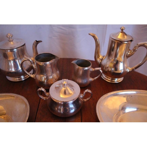 121 - Eight pieces of Hotel quality Silver Plate comprising of Tea and a Coffee Pot, Jug and a Creamer, Su... 