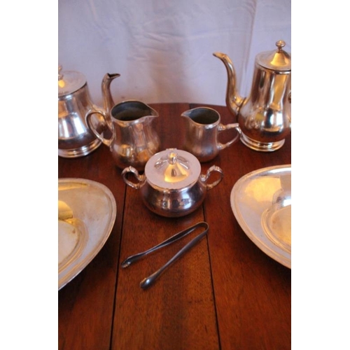 121 - Eight pieces of Hotel quality Silver Plate comprising of Tea and a Coffee Pot, Jug and a Creamer, Su... 