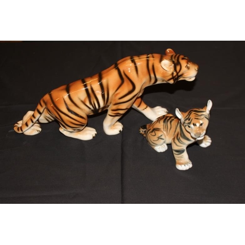 165 - Royal Dux Porcelain Figure of a Tiger together with an assicated Tiger Cub Figure (39cm long)