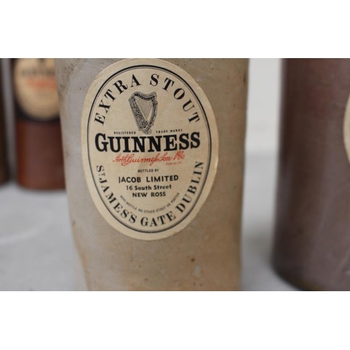 26 - 7 Various Ironstone Bottles including Guinness Example (Tallest 28cm)