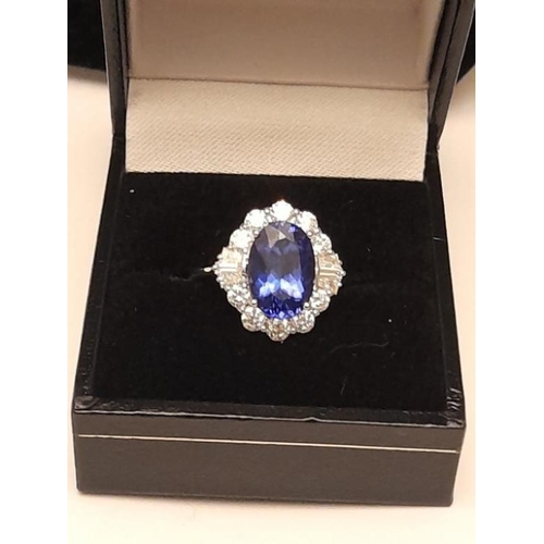 373 - 18 Carat White Gold Natural Tanzanite and Diamond Cluster Ring.  The Art Deco piece has a natural Ta... 