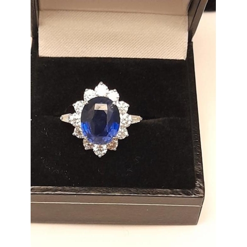 377 - 18 Carat White Gold Natural Ceylon Sapphire 4.90ct surrounded by 2.00 carats. G Colour Round Diamond... 