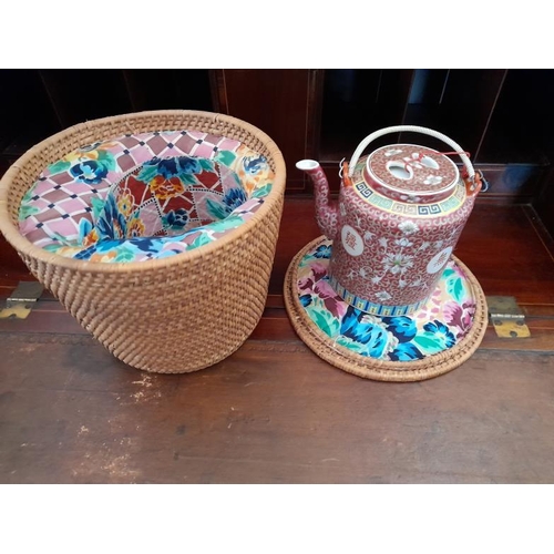 881 - Oriental Red Porcelain Tea Pot in original padded Wicker Basket (Basket 20cm Tall)