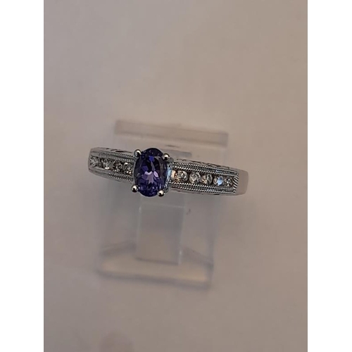 810 - 14 Carat Diamond and Tanzanite Ring .28 Carat (Size L)