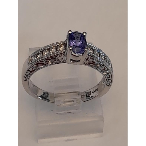 810 - 14 Carat Diamond and Tanzanite Ring .28 Carat (Size L)