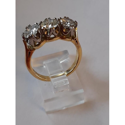 812 - 18 Carat Yellow Gold Three Stone Diamond 3 carats Ring claw set in this timeless design. Diamond Col... 