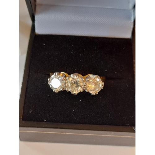 812 - 18 Carat Yellow Gold Three Stone Diamond 3 carats Ring claw set in this timeless design. Diamond Col... 