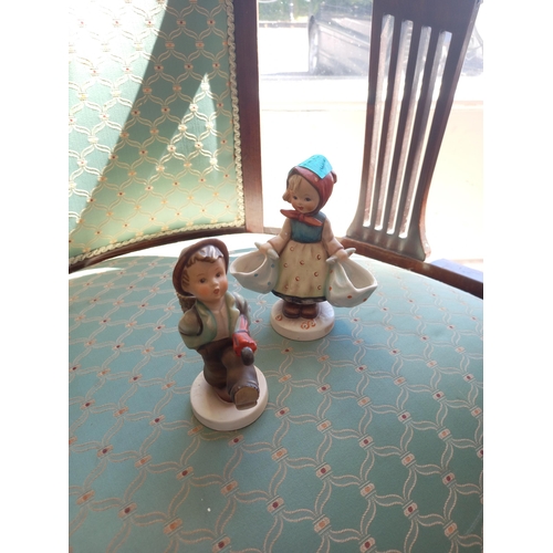 123 - A Hummel and a Goebel Figure