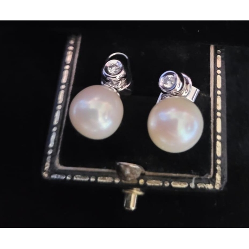 709 - 18 Carat Diamond and Pearl Earrings