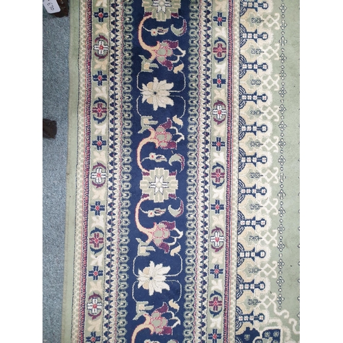 28 - Large Green and Blue Ground Medallion Pattern Floor Rug (16' x 8')