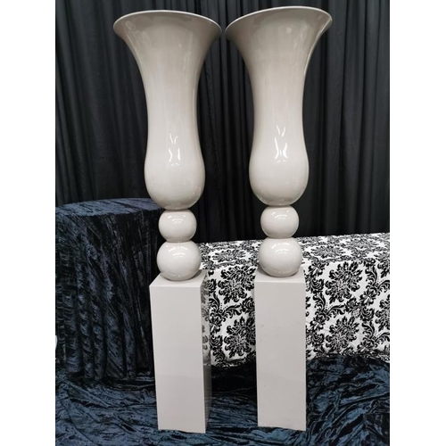 18 - 2 Glossy Taupe Pedestal Urns (one minor repair done)