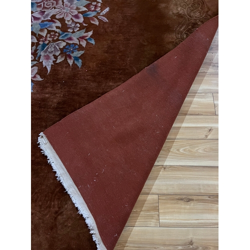 93 - Large Centre Rug with Brown Background and Central Floral Design (370 cm W x 280 cm H)