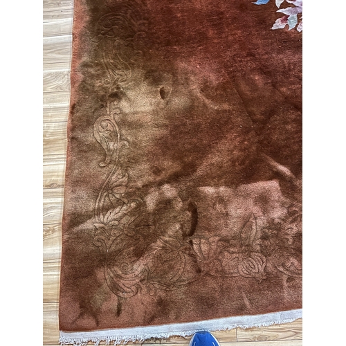 93 - Large Centre Rug with Brown Background and Central Floral Design (370 cm W x 280 cm H)