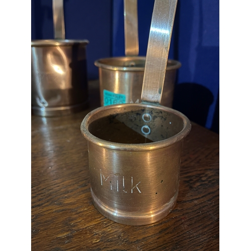 160 - Three Copper Jelly Moulds and a Set of Three Graduated Copper Handled Milk Ladles