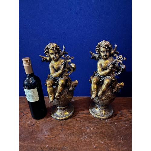 172 - Two Decorative Gold Wall Sconces and a Pair of Gold Ornaments, Putti with Lyres (Pair 32 cm H)