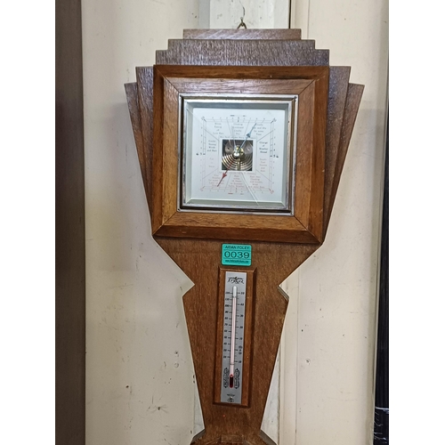 39 - Edwardian Carved Oak Barometer and an Art Deco Barometer (both glass cracked)