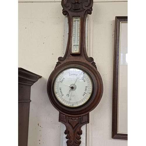 39 - Edwardian Carved Oak Barometer and an Art Deco Barometer (both glass cracked)