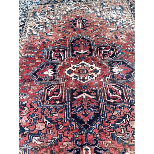 719 - Heriz Persian Rug (320 cm W x 226 cm H)