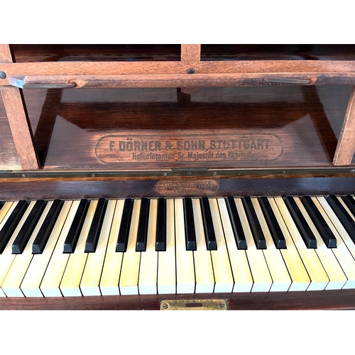 49 - F. Dorner & Sohn, Stuttgart, Walnut Cased Upright Piano (155 cm W x 130 cm H x 58 cm D)