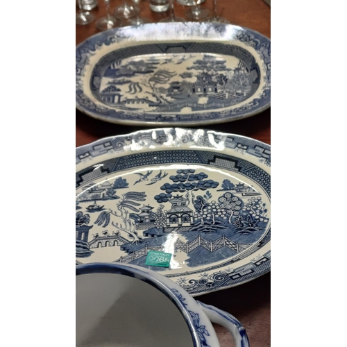 68 - Two Blue and White Willow Pattern Platters, a Spode Cup and Saucer, Jardiniere and a Milk Jug