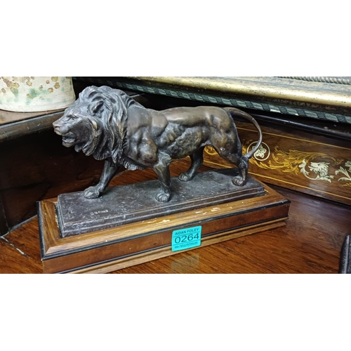 264 - Bronze Lion on a Wooden Stand together with 2 others