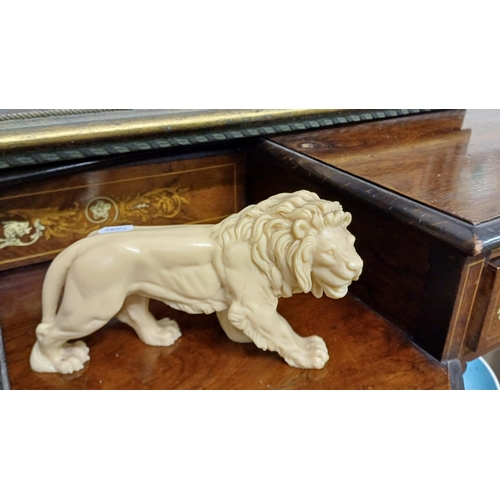 264 - Bronze Lion on a Wooden Stand together with 2 others