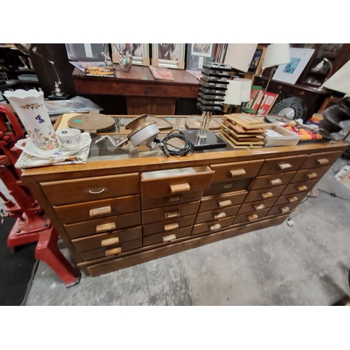 135 - Good Vintage Oak and Glass Haberdashery Shop Cabinet with 25 Sliding Drawers (183cm Long) from Pauli... 