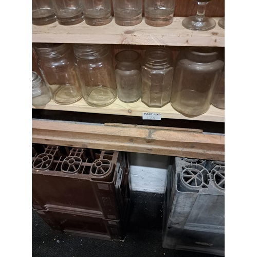 176 - Shelf of old Bottles and Jars including the bottom shelf of the cabinet