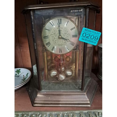 209 - Anniversary Clock and a Brass Restaurant Sign (as found melted ) Anniversary Clock rescued  from Wil... 