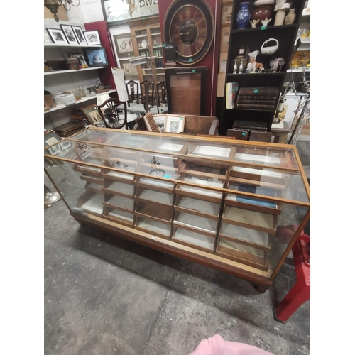 135 - Good Vintage Oak and Glass Haberdashery Shop Cabinet with 25 Sliding Drawers (183cm Long) from Pauli... 