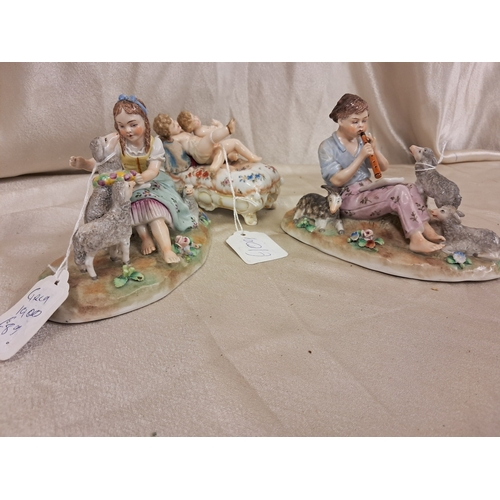 711 - Three Decorative Continental Porcelain Figural Groups (Tallest 11cm)