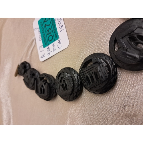 875 - Irish Bog Oak Necklace consisting of 13 circular Carved Panels of Castles and Abbeys (40cm Long)