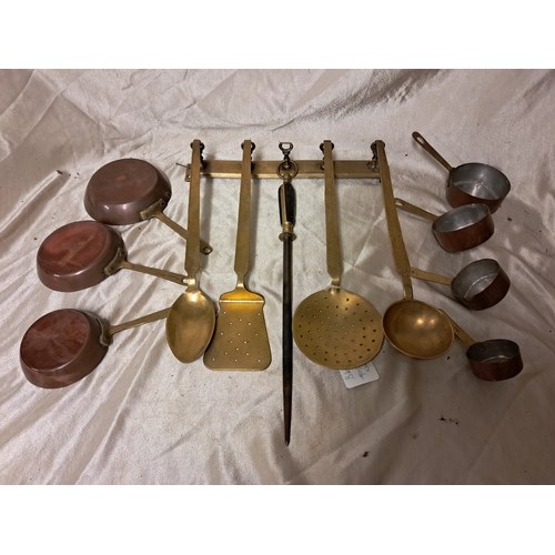 1347 - Lot of Brass Kitchen Utensils on Rack together with a collection of Copper and Brass Sauce Pots and ... 