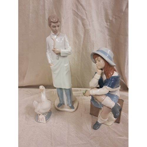 695 - Nao Porcelain Figure of a Doctor (34cm), Nao Goose and a Nadal Girl