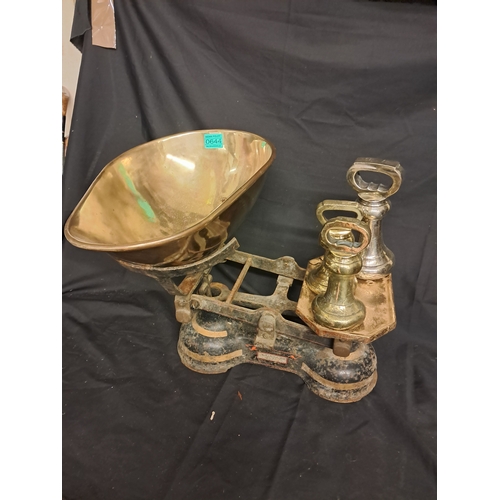 644 - Cast Iron and Brass Shop Scales by Simpson and Co. Belfast with 3 Dumbbell Weights (7lb and 2 x 4lb)