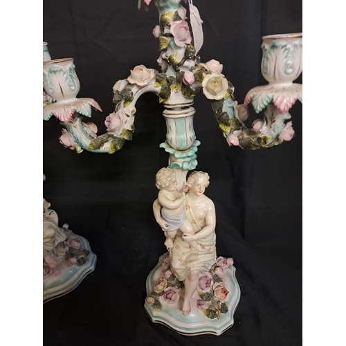 537 - Pair of German Porcelain Figural Candelabra with encrusted Floral Decoration (49cm Tall)