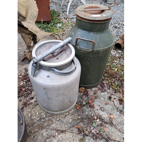 1049 - Two good old Churns - one Cast Iron and One Aluminium