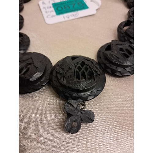 875 - Irish Bog Oak Necklace consisting of 13 circular Carved Panels of Castles and Abbeys (40cm Long)