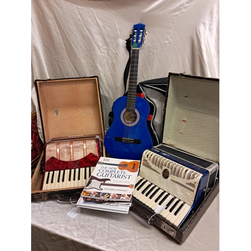 939 - Cased Child's Guitar and some Guitar Books together with 2 Cased Accordions