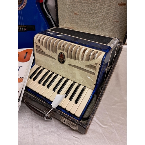 939 - Cased Child's Guitar and some Guitar Books together with 2 Cased Accordions