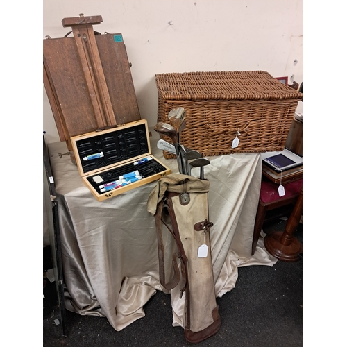 995 - Vintage Artists Travel Easel, Wicker Basket, Artists Box with paints and a set of Golf Clubs