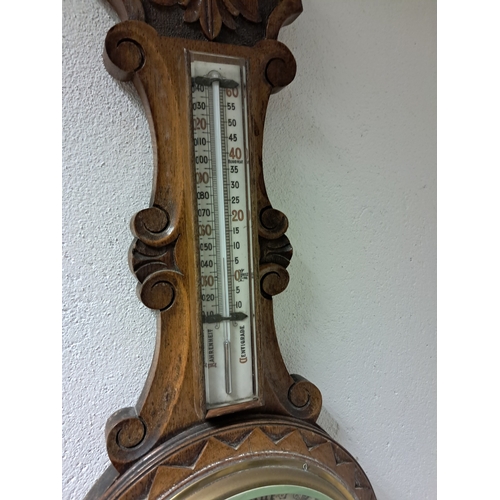 399 - Edwardian Carved Oak Barometer - seems to be working (88cm Long)