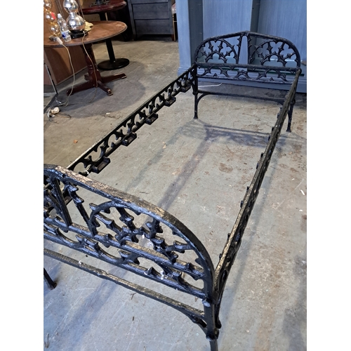 528 - Pair of Black painted Cast Iron Day Beds decorated in the Gothic taste (169cm x 70cm)