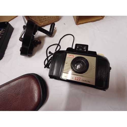 Two Vintage Cameras and a lot of Singer Sewing Machine Attachments