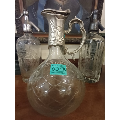 16 - Two old Schweppes Soda Syphons and a Claret Jug