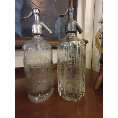 16 - Two old Schweppes Soda Syphons and a Claret Jug