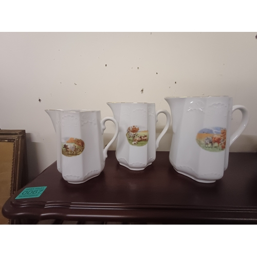 68 - Three Lustreware Milk Jugs and a Set of 3 Graduated Porcelain Dresser Jugs