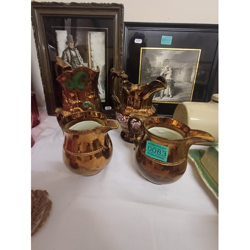 83 - Four Victorian Lustreware Dresser Jugs and 3 others