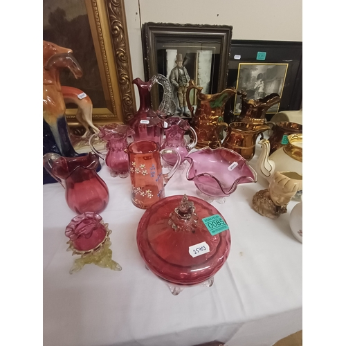 85 - Collection of Cranberry Glass including Decanter, Jugs, Lidded Jar and Bowl